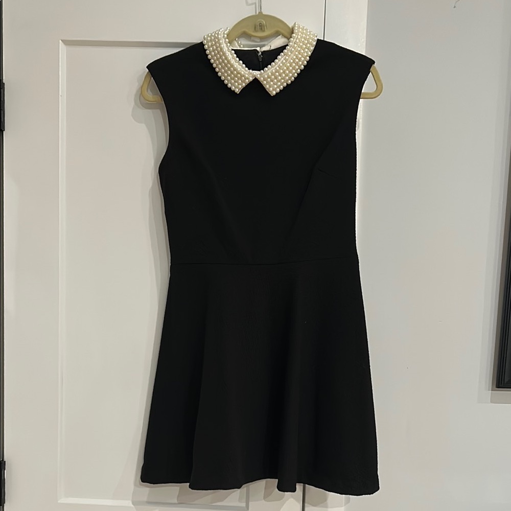 Elegant Black Dress with Pearl Collar